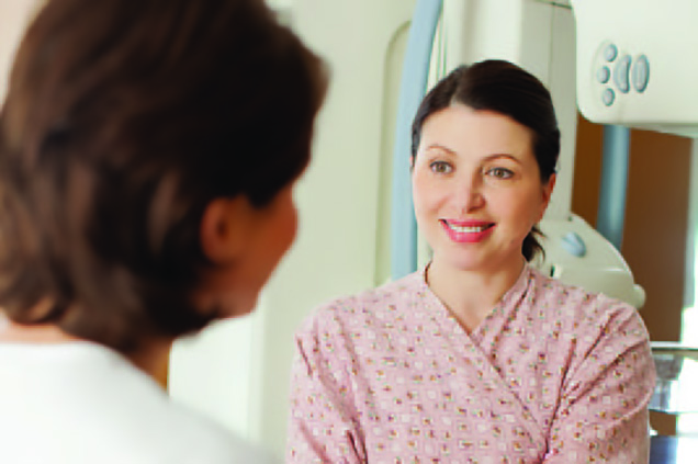 Physician speaking to female patient