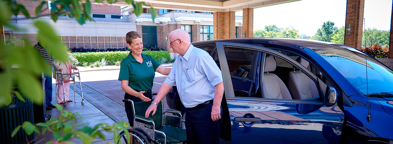 Valet service assisting visitor