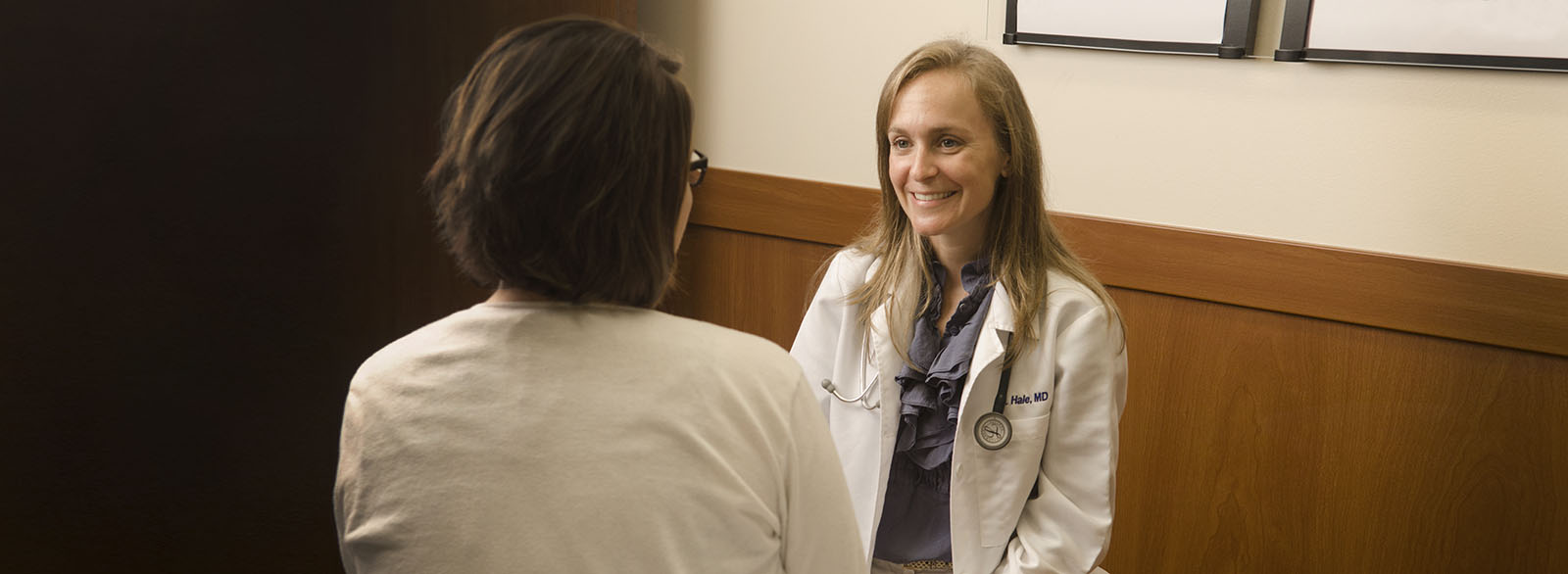 VIMCare physician speaking with patient in exam room