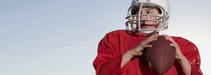 Young boy in football uniform