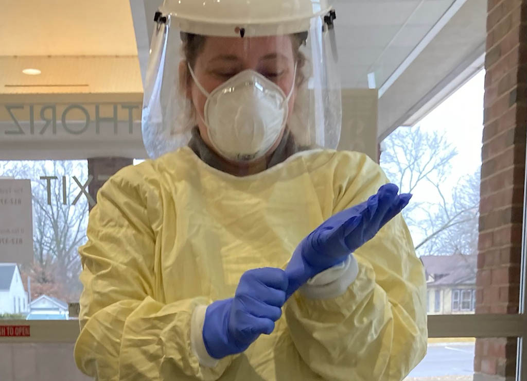 Phlebotomist Alexis Houser at the drive-thru testing location.