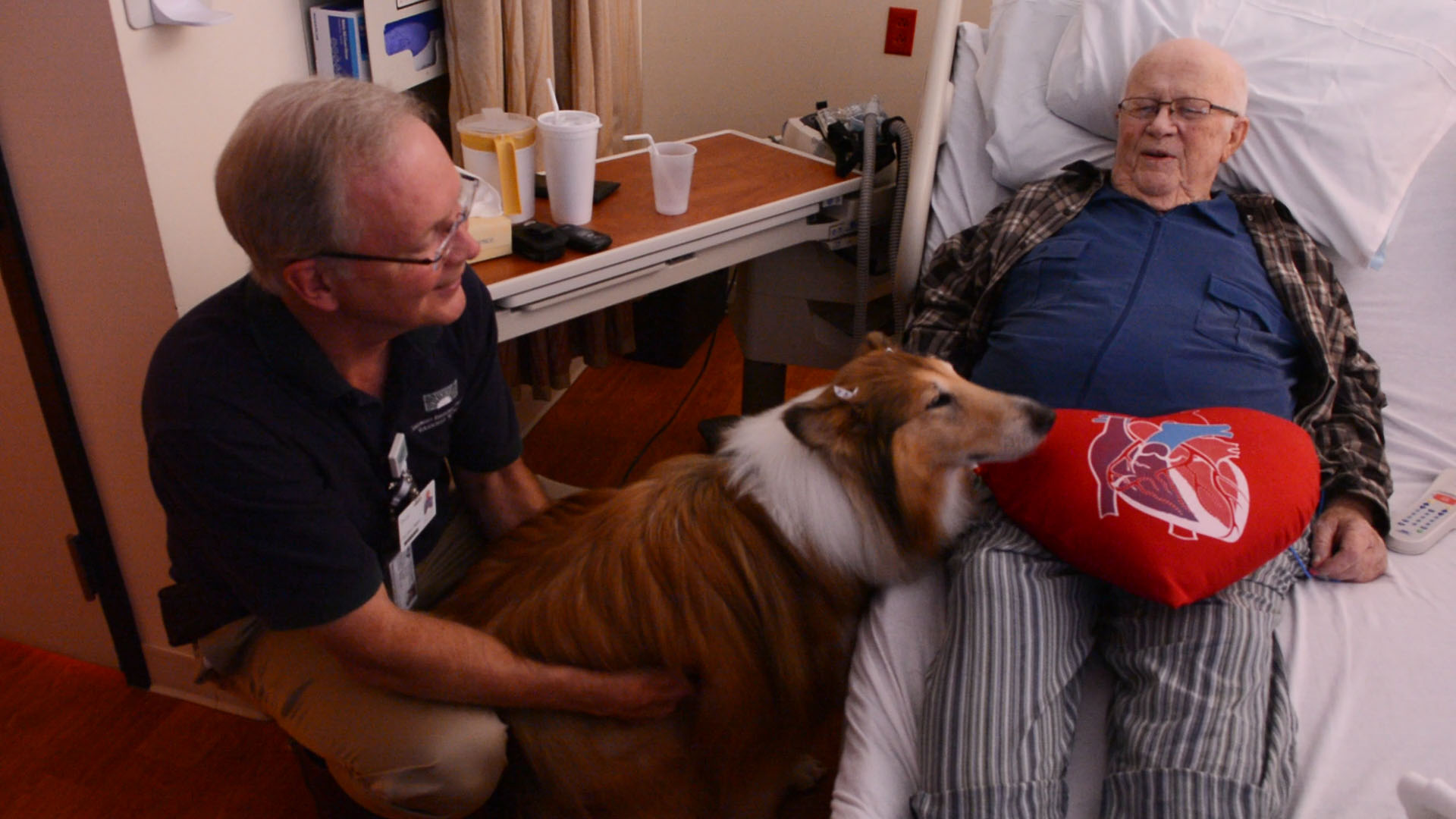 hideme_bonniesfarewell Doug Bell and therapy dog Bonnie visit a patient at Columbus Regional Hospital